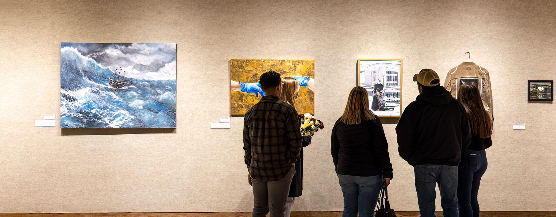 Students viewing Student Art Exhibition in Schlueter Art Gallery